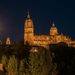 Stunning night view of Salamanca Cathedral illuminated, capturing its architectural elegance.